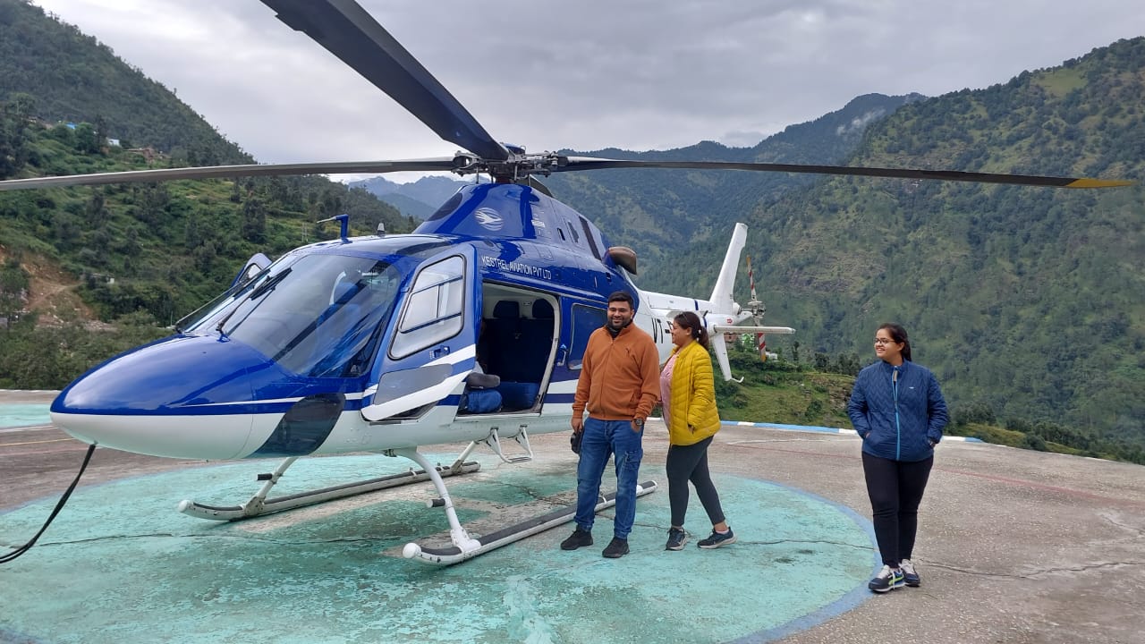 Helicopter over snow peaks